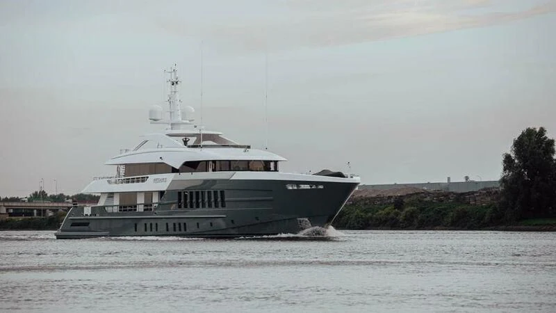a large boat on the water aboard RELIANCE Yacht for Sale