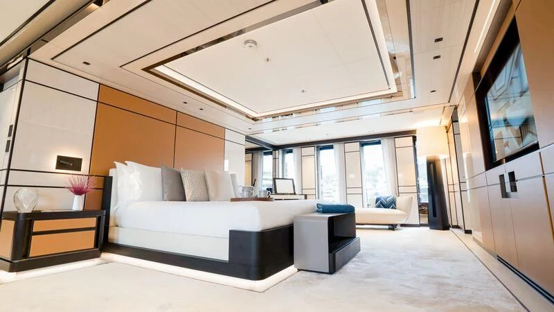 a room with a bed and a desk aboard RELIANCE Yacht for Sale