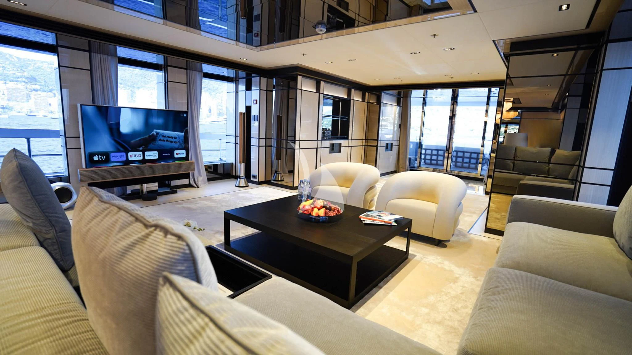 a living room with a large screen aboard RELIANCE Yacht for Sale
