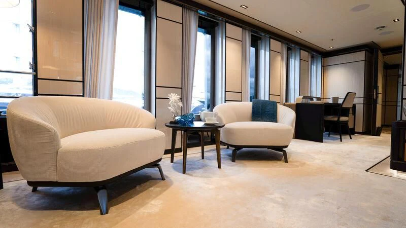 a living room with a couch and a coffee table aboard RELIANCE Yacht for Sale