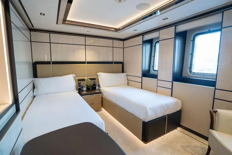 a room with two beds aboard RELIANCE Yacht for Sale