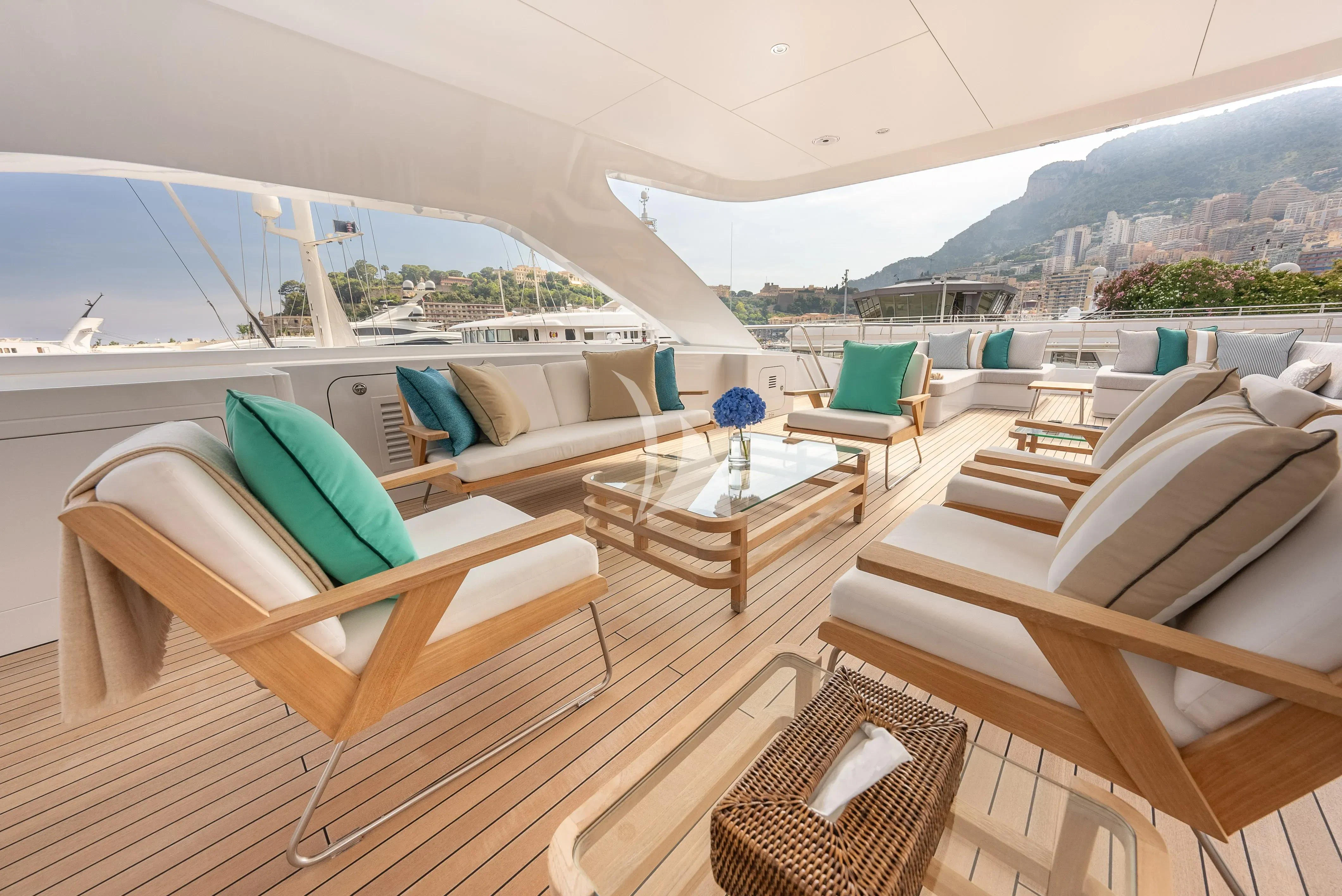 a room with a couch and a table and chairs aboard RELIANCE Yacht for Sale