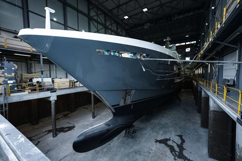 a large metal airplane in a warehouse aboard RELIANCE Yacht for Sale