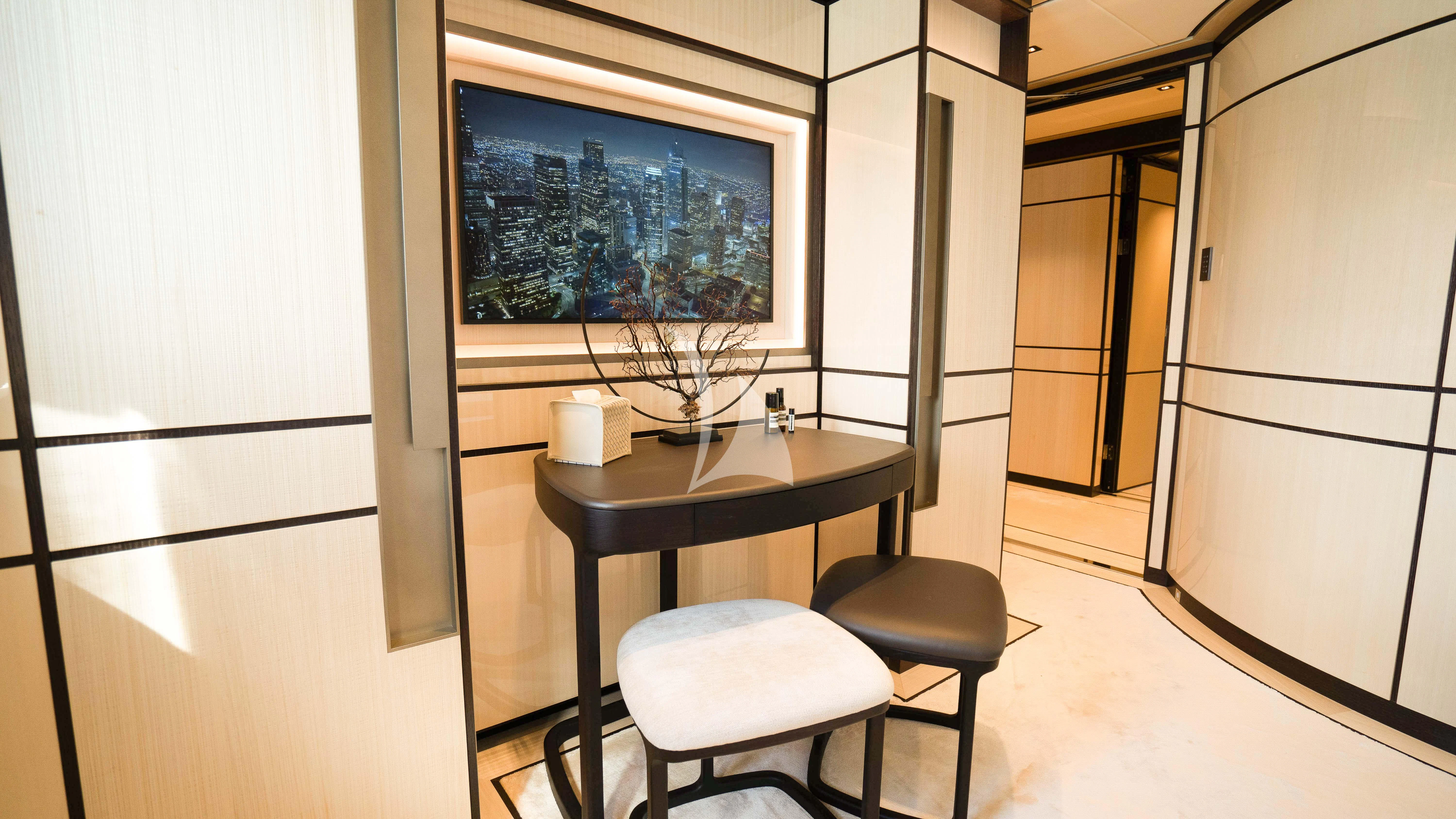 a table and stool in a room aboard RELIANCE Yacht for Sale