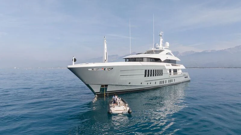 a large white boat in the water aboard RELIANCE Yacht for Sale