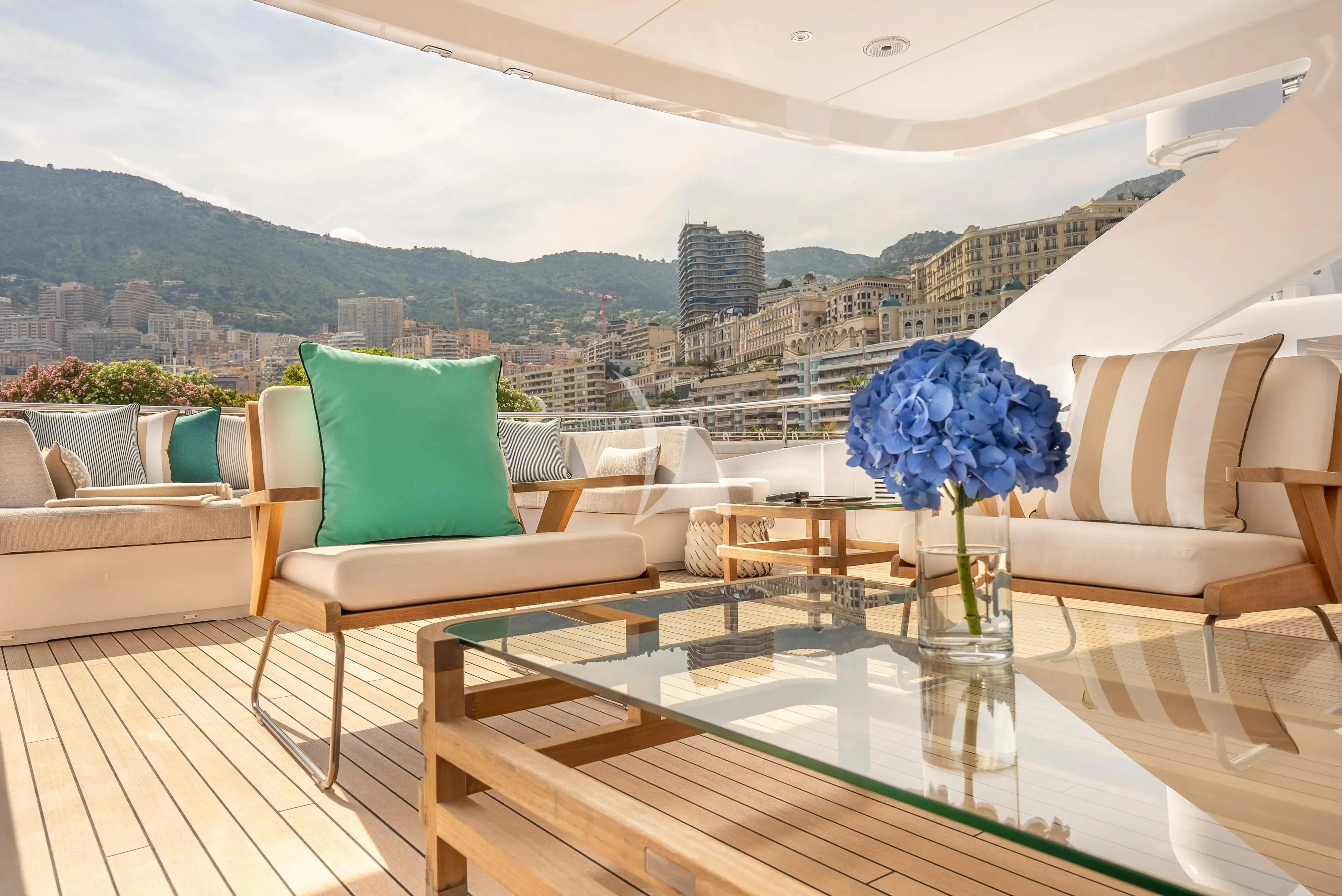 a room with a table and chairs aboard RELIANCE Yacht for Sale