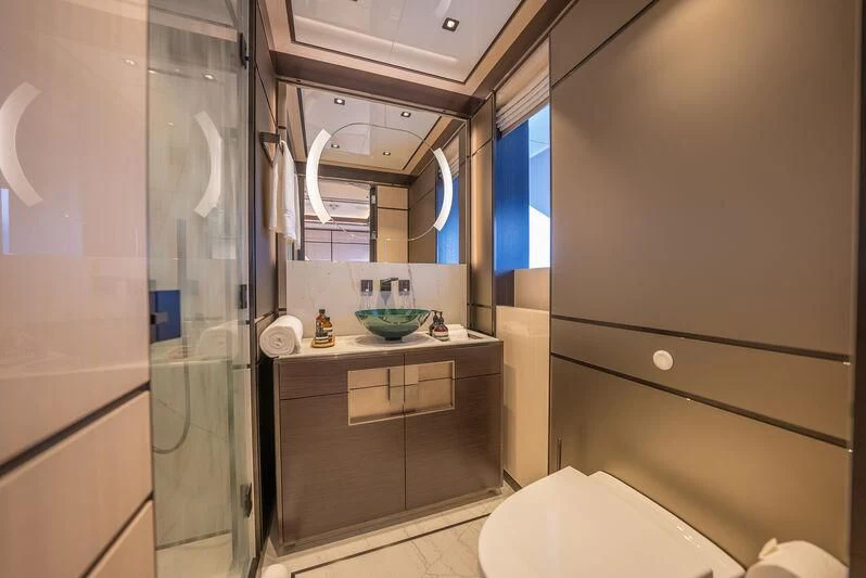 a bathroom with a glass shower aboard RELIANCE Yacht for Sale