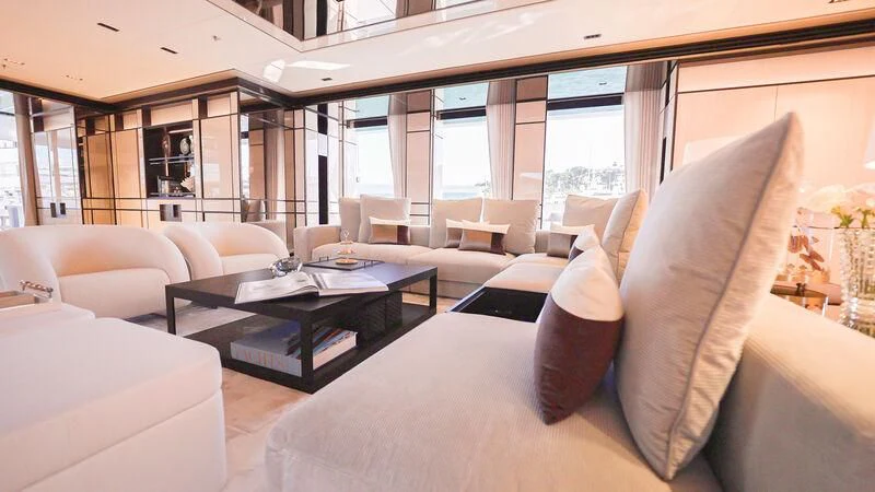 a living room with a large window aboard RELIANCE Yacht for Sale