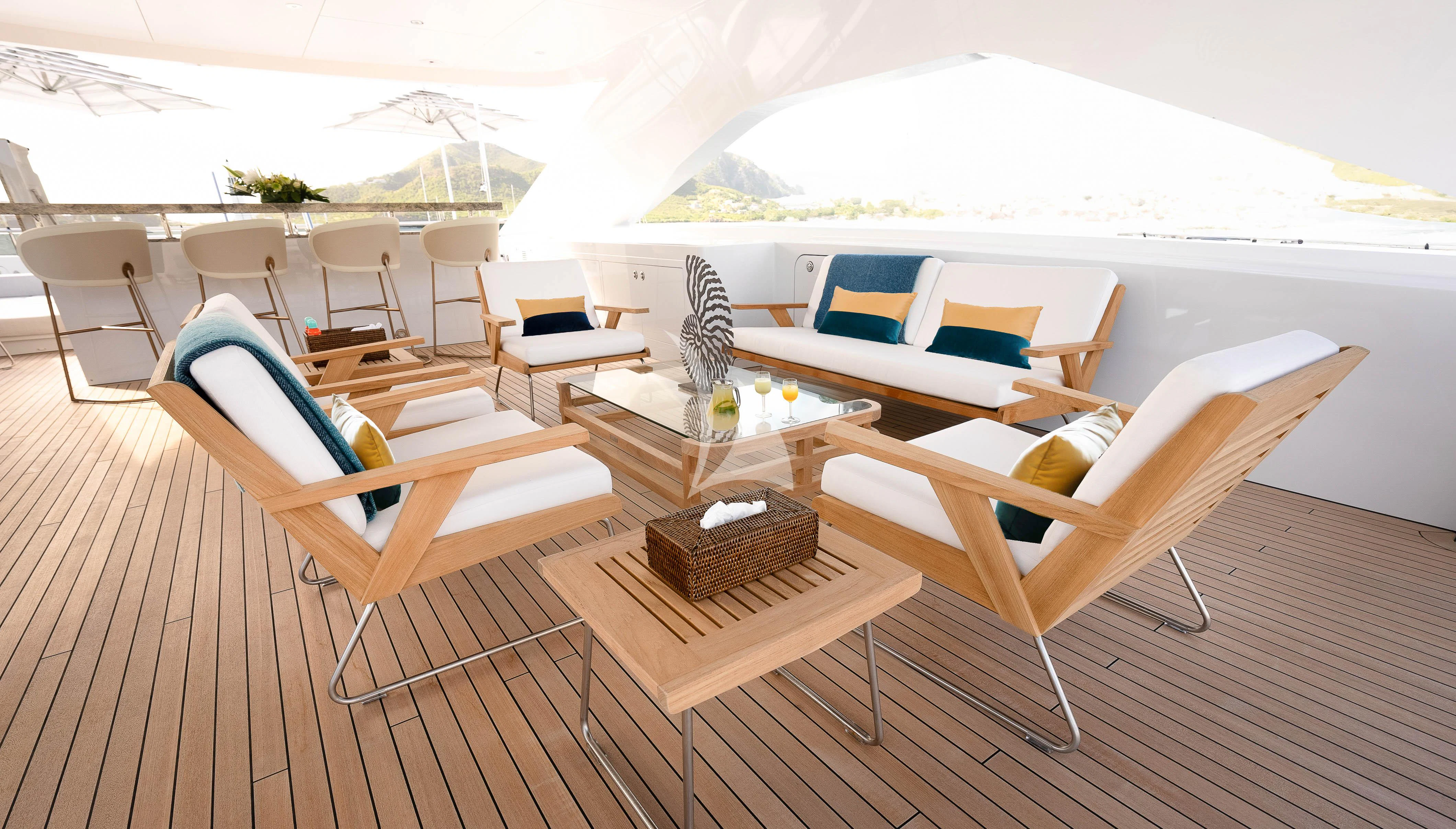 a room with chairs and tables aboard RELIANCE Yacht for Sale