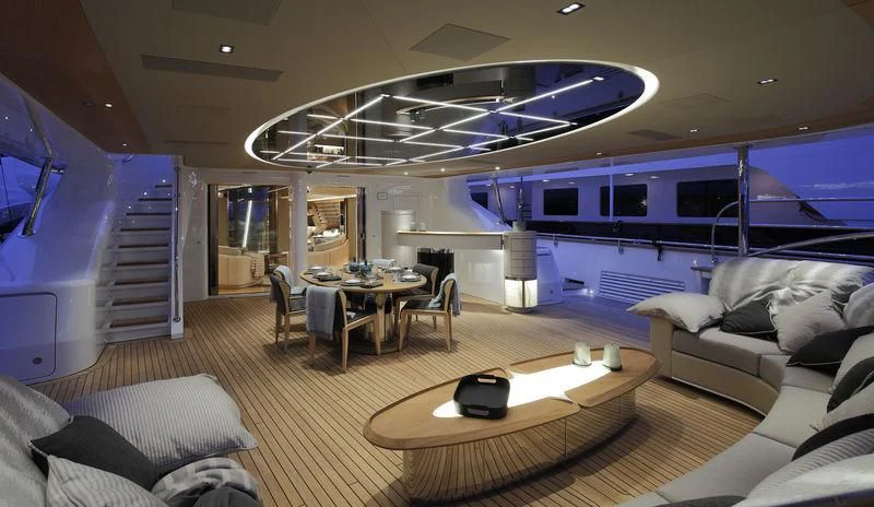 a living room with a large open door aboard SEVEN Yacht for Sale