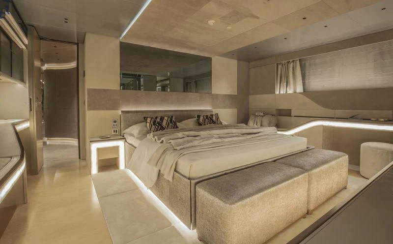 a room with a bed and a desk aboard SEVEN Yacht for Sale