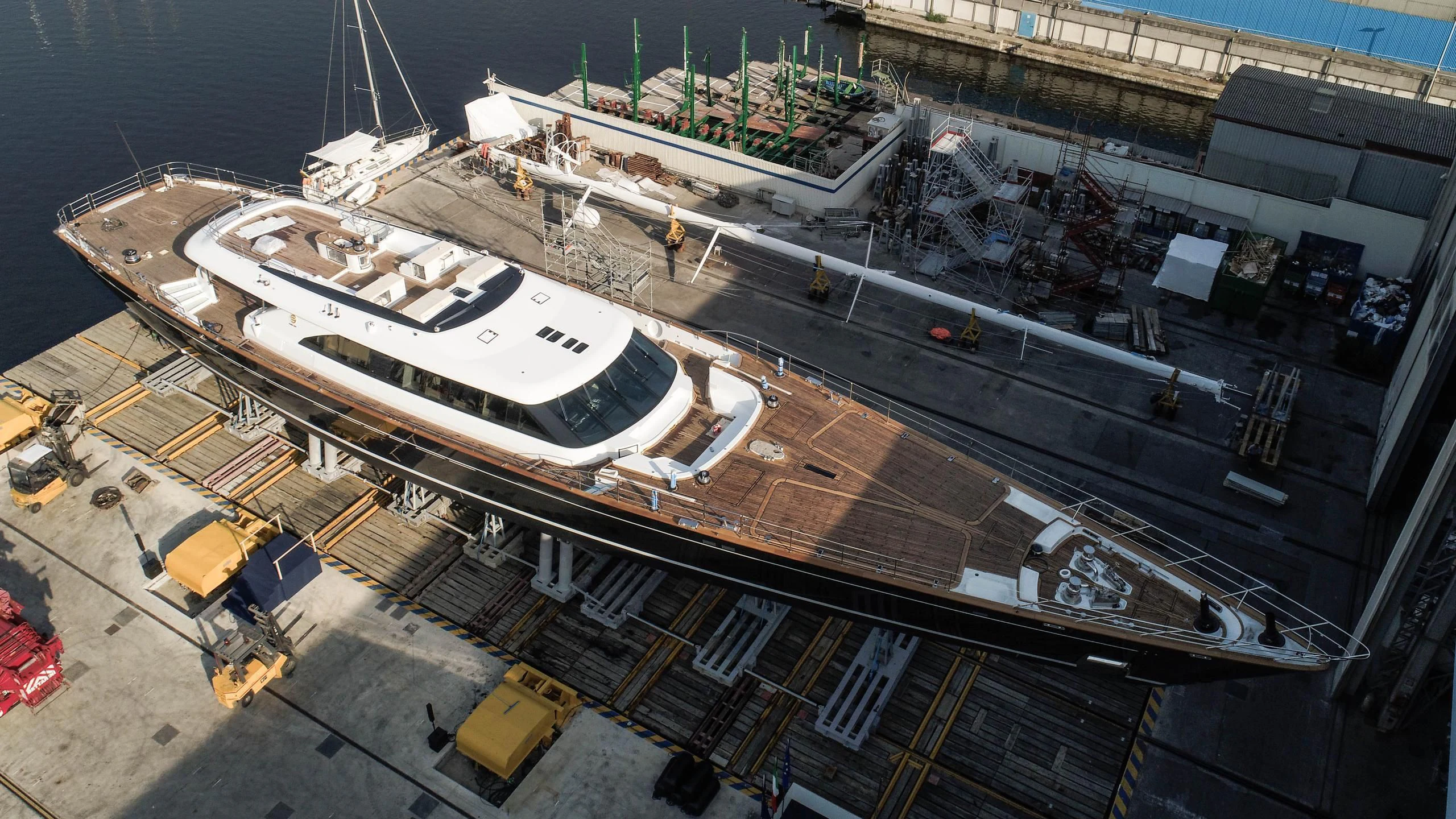 a large cruise ship docked aboard SEVEN Yacht for Sale