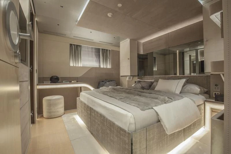 a bedroom with a bed and a sink aboard SEVEN Yacht for Sale