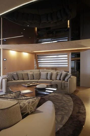 a living room with a couch and a coffee table aboard SEVEN Yacht for Sale
