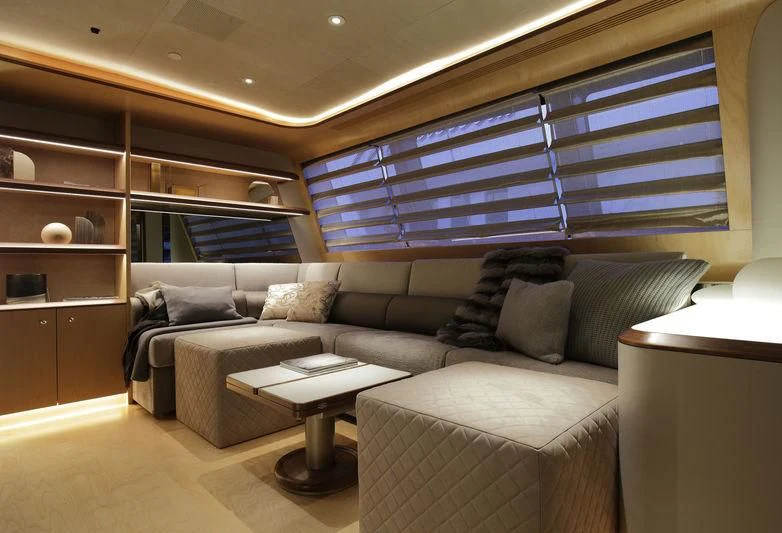 a living room with a couch and a coffee table aboard SEVEN Yacht for Sale