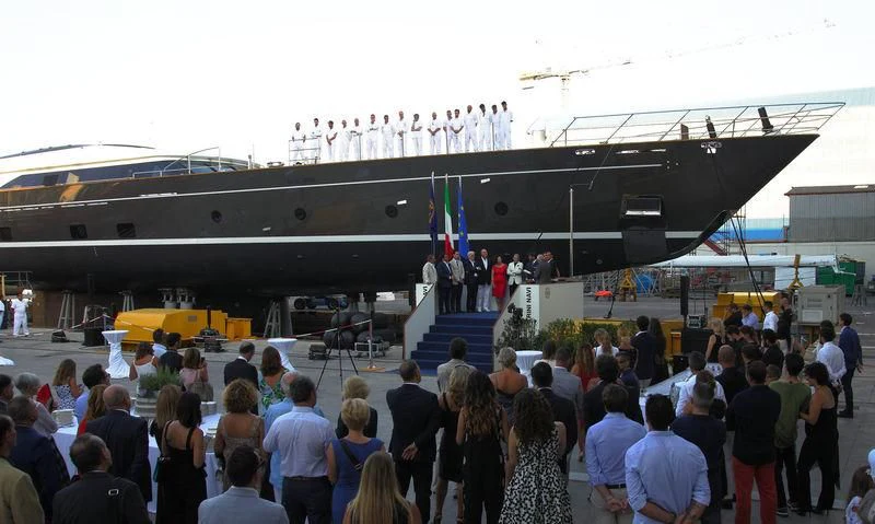 a group of people standing in a large room with a large crowd of people aboard SEVEN Yacht for Sale