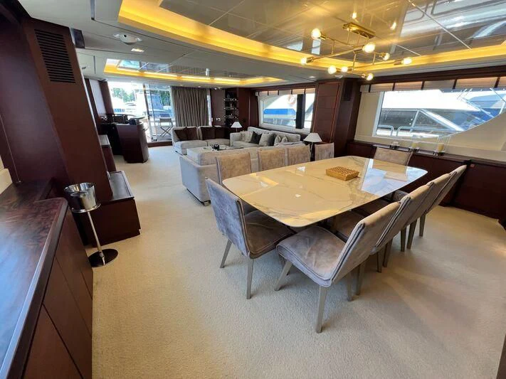 a dining table in a room aboard VIVERE Yacht for Sale