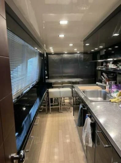 a kitchen with a large blue counter aboard VIVERE Yacht for Sale