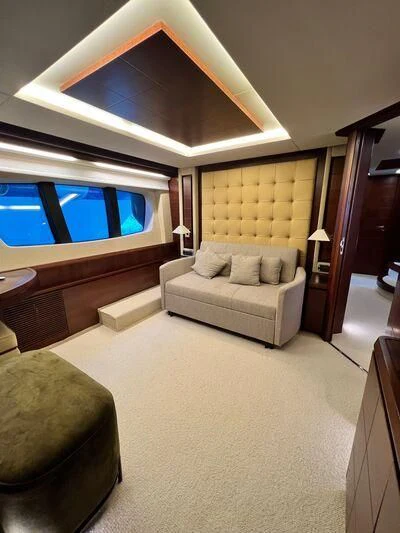 a living room with a large television aboard VIVERE Yacht for Sale