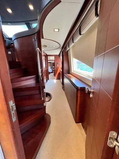 a hallway with wooden doors aboard VIVERE Yacht for Sale