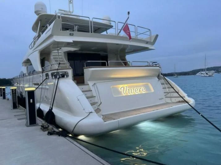 a boat docked at a pier aboard VIVERE Yacht for Sale