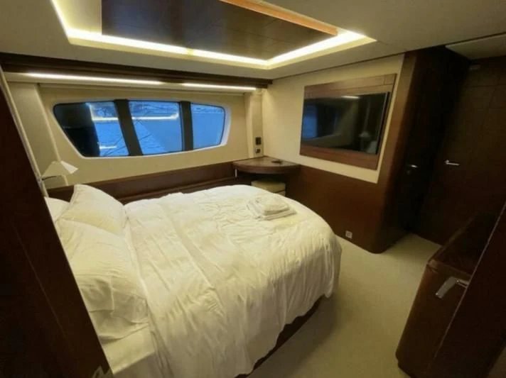 a bed in a room aboard VIVERE Yacht for Sale
