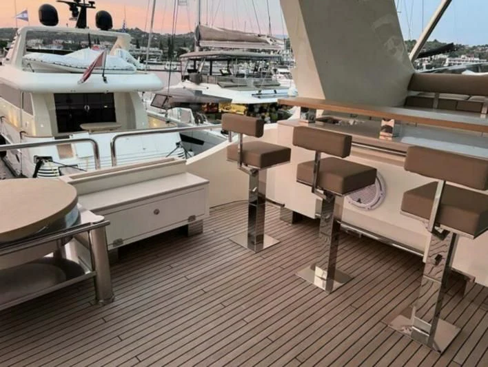 a boat dock with several white boats aboard VIVERE Yacht for Sale