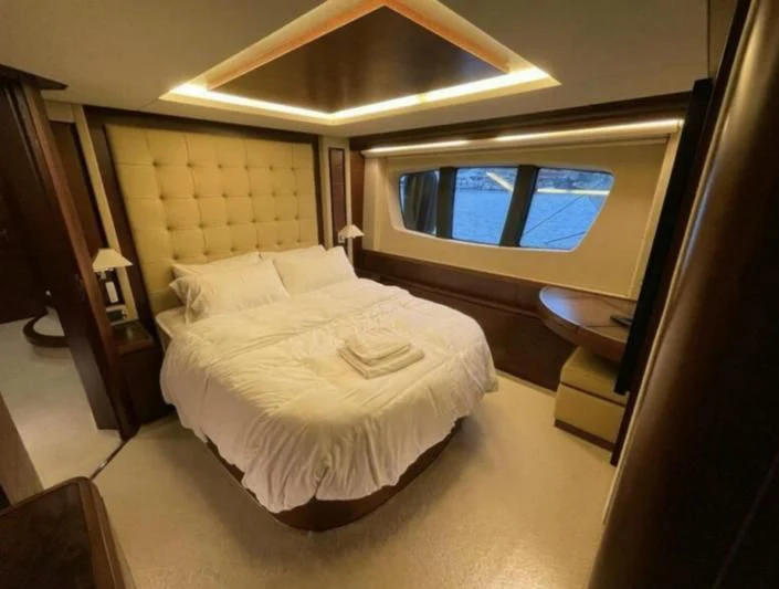 a hotel room with a large bed aboard VIVERE Yacht for Sale