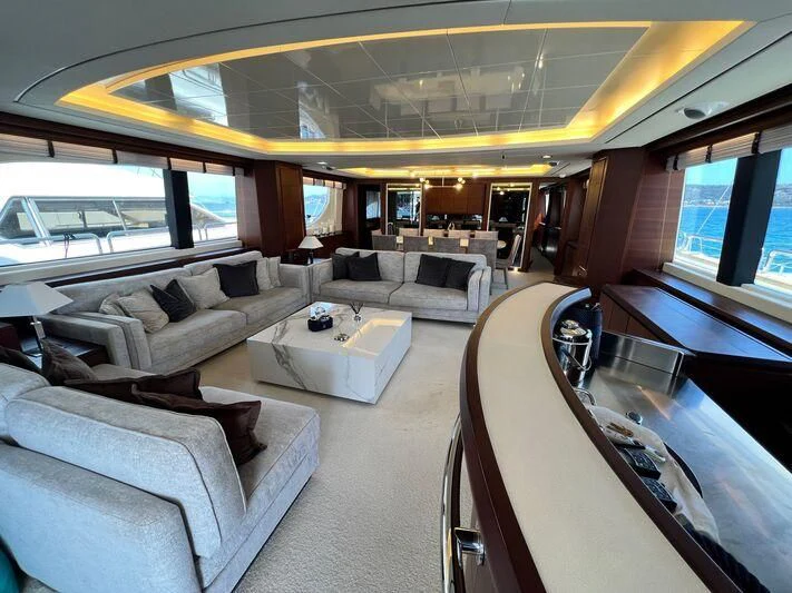 a train with a couch and a table aboard VIVERE Yacht for Sale