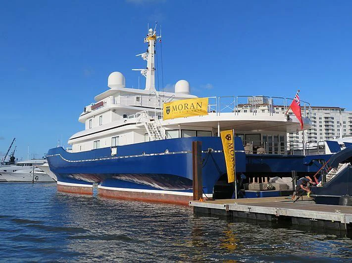 a large white boat docked aboard NURJA Yacht for Sale