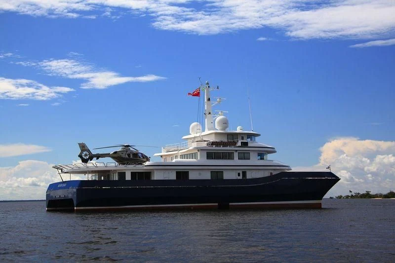 a large ship in the water aboard NURJA Yacht for Sale