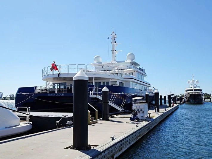 a large cruise ship docked aboard NURJA Yacht for Sale