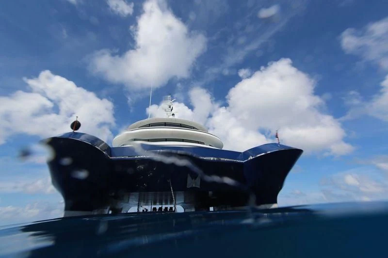 a large ship in the water aboard NURJA Yacht for Sale