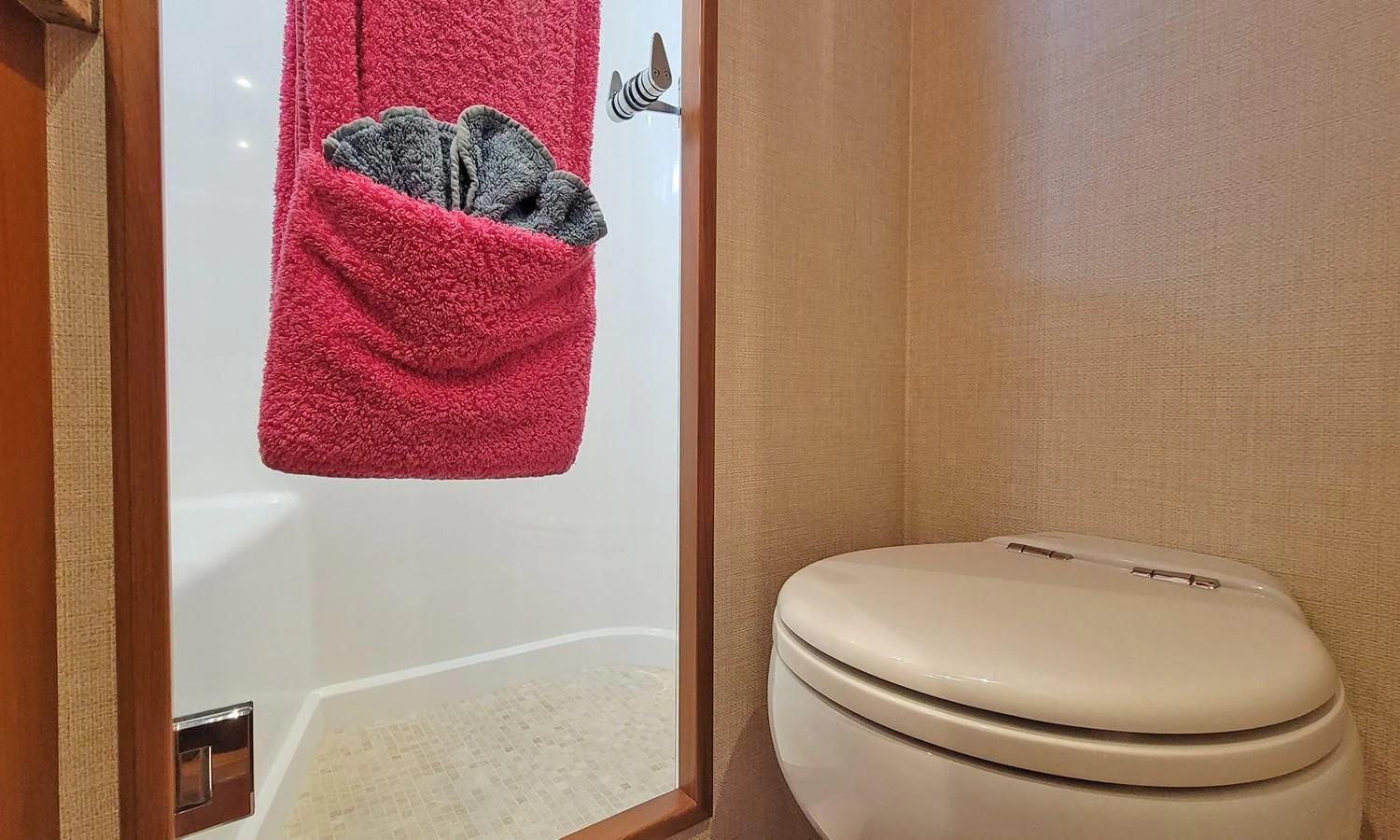 a towel on a toilet aboard SUERTUDO Yacht for Sale