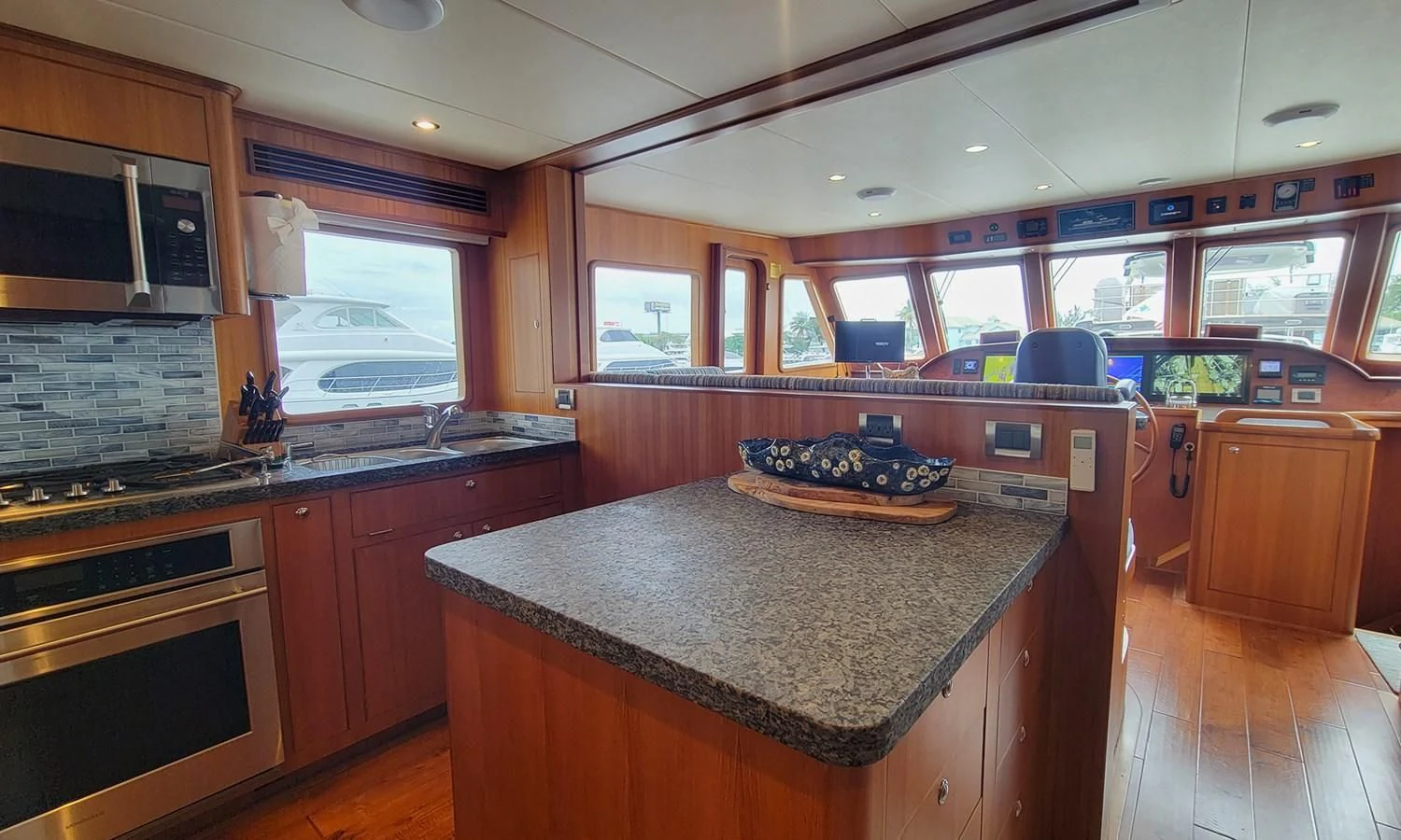 a kitchen with a large island aboard SUERTUDO Yacht for Sale