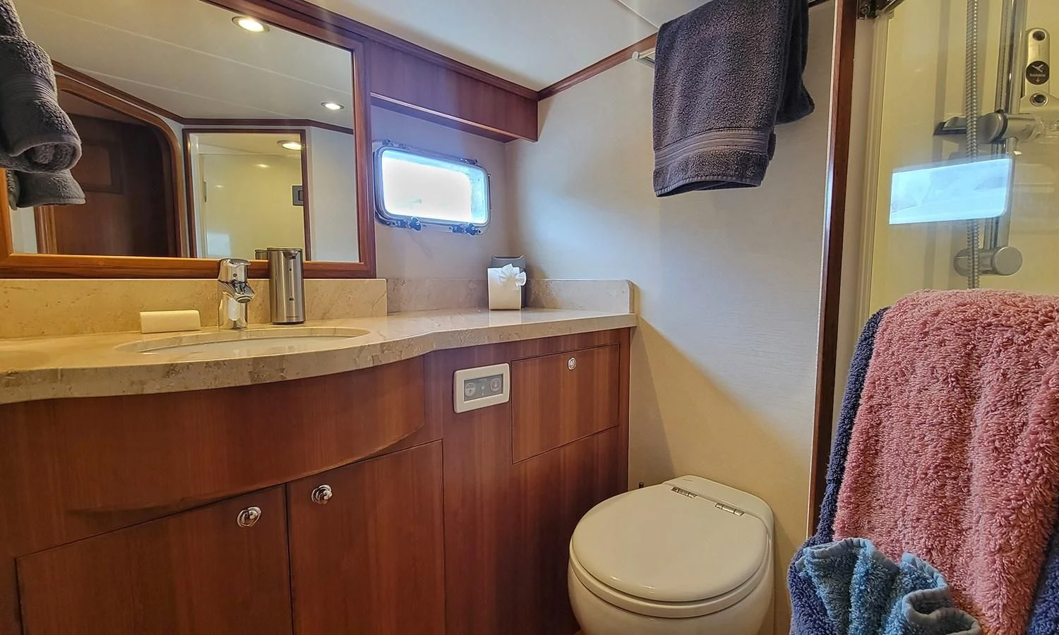 a bathroom with a sink and a mirror aboard SUERTUDO Yacht for Sale