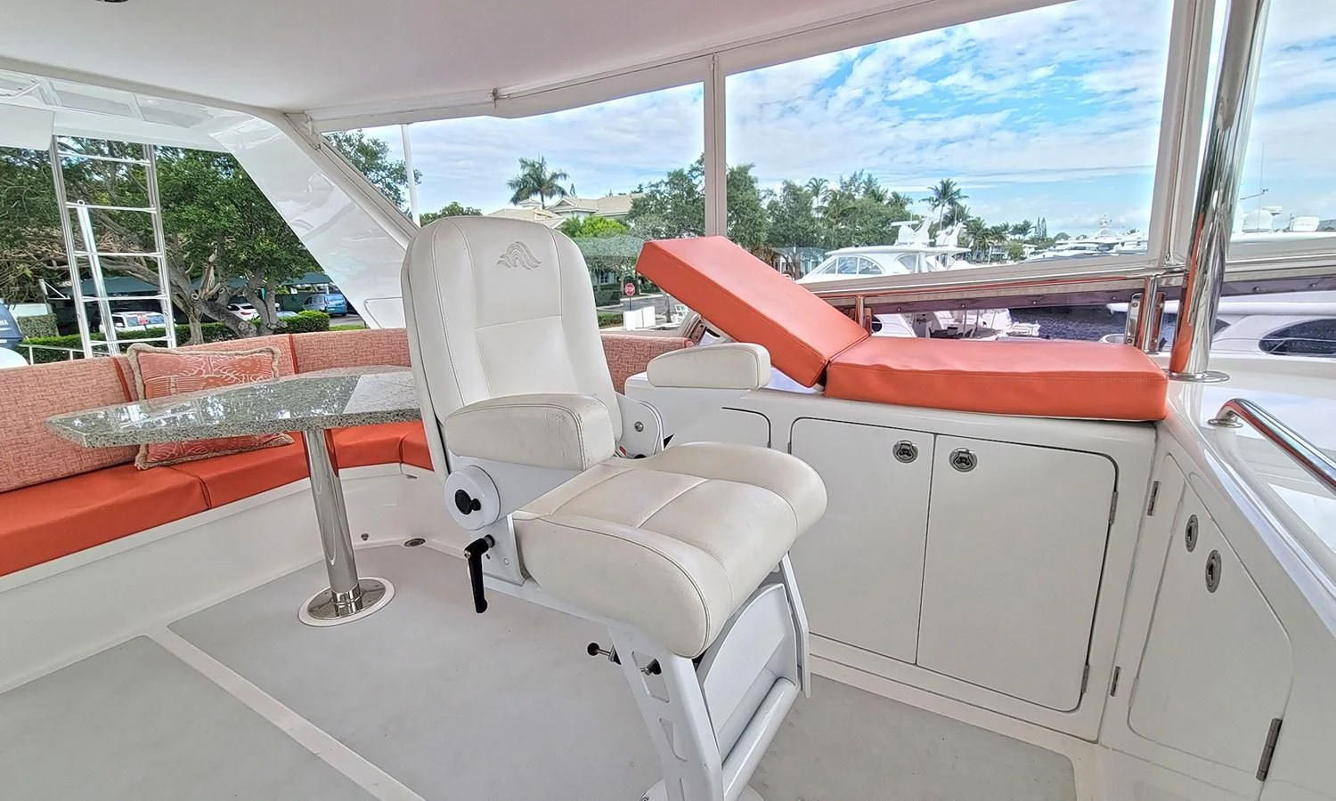 a white chair in a room aboard SUERTUDO Yacht for Sale