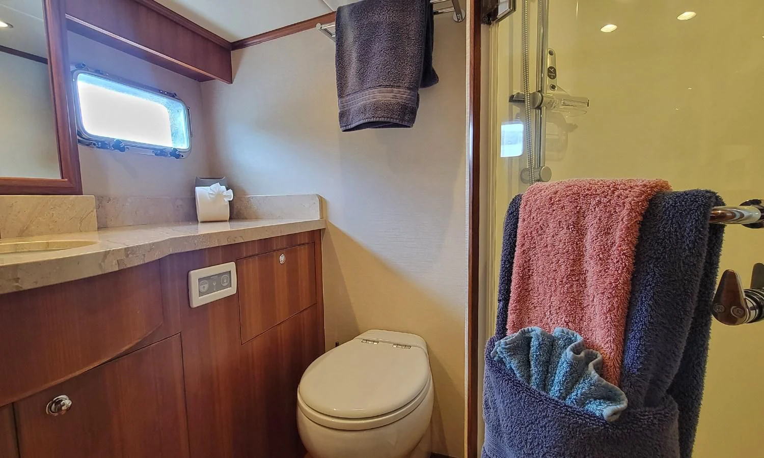 a bathroom with a towel on the wall aboard SUERTUDO Yacht for Sale