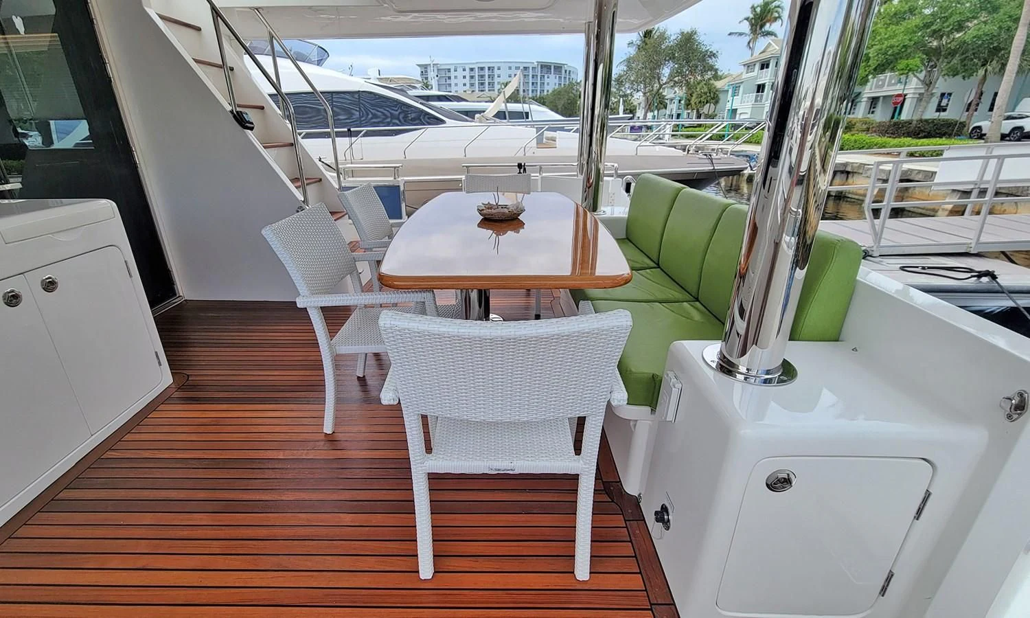 a table and chairs on a deck aboard SUERTUDO Yacht for Sale
