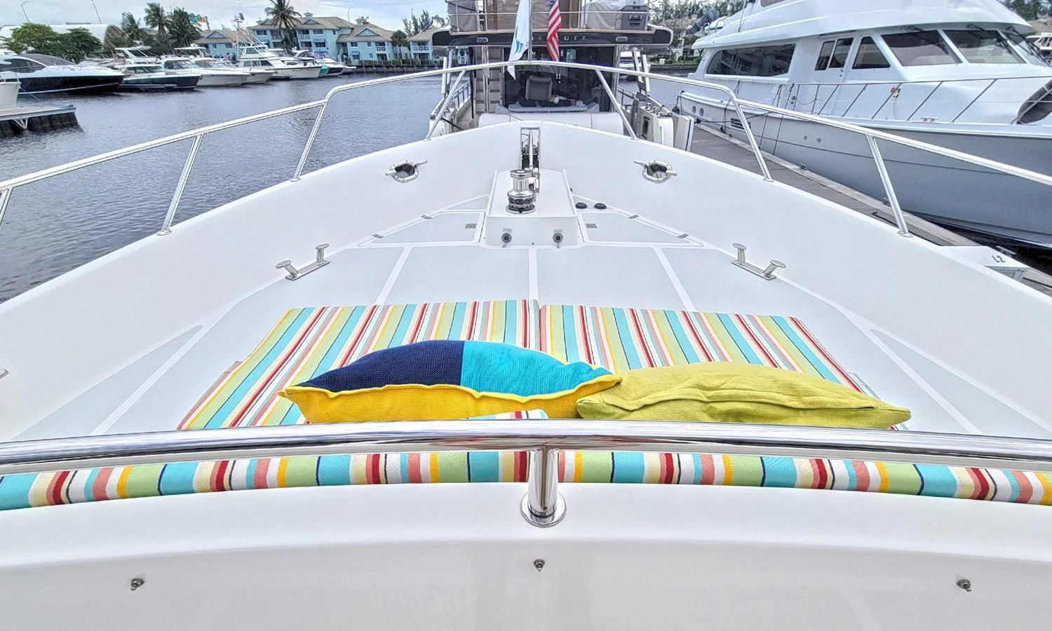 a colorful umbrella on a boat aboard SUERTUDO Yacht for Sale