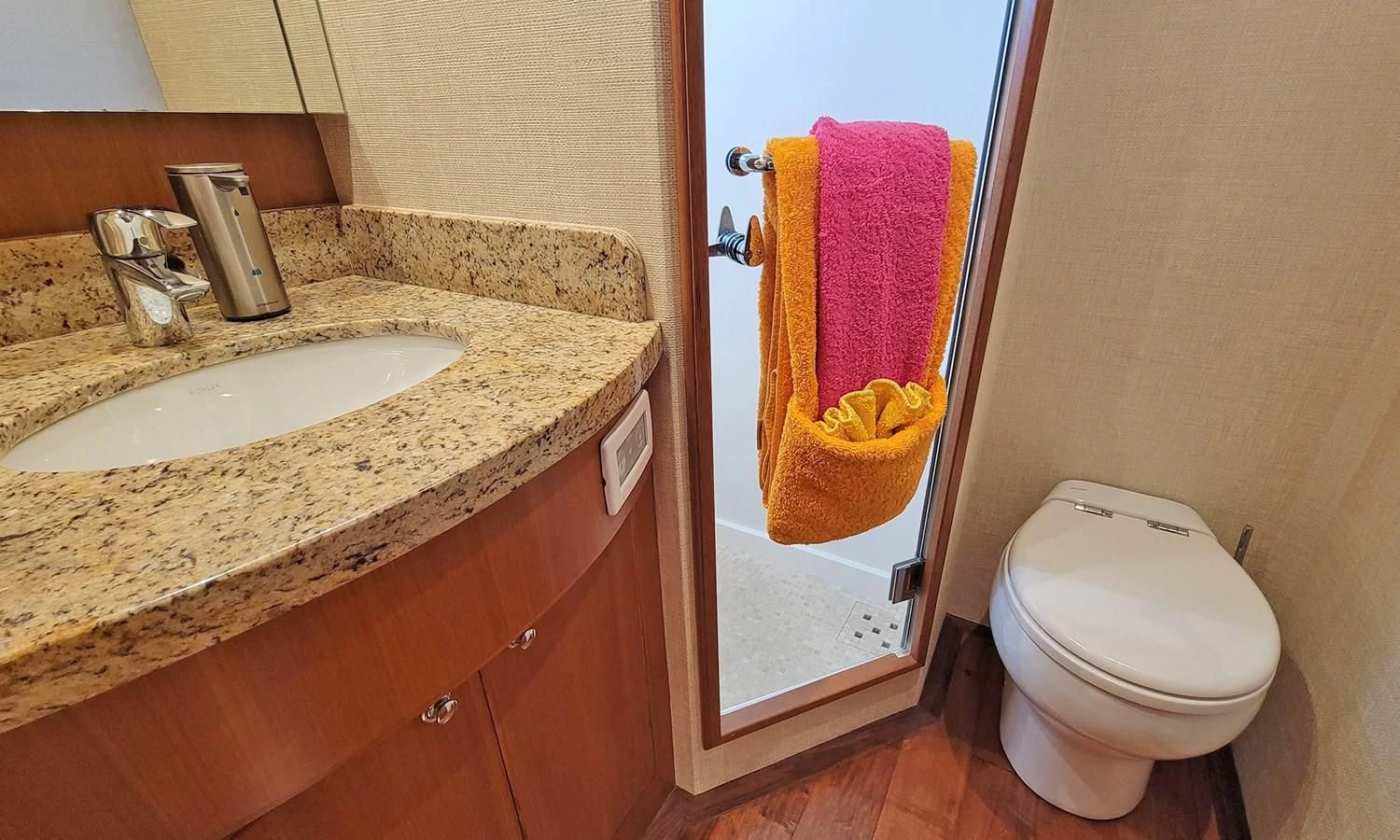 a bathroom with a sink and a toilet aboard SUERTUDO Yacht for Sale