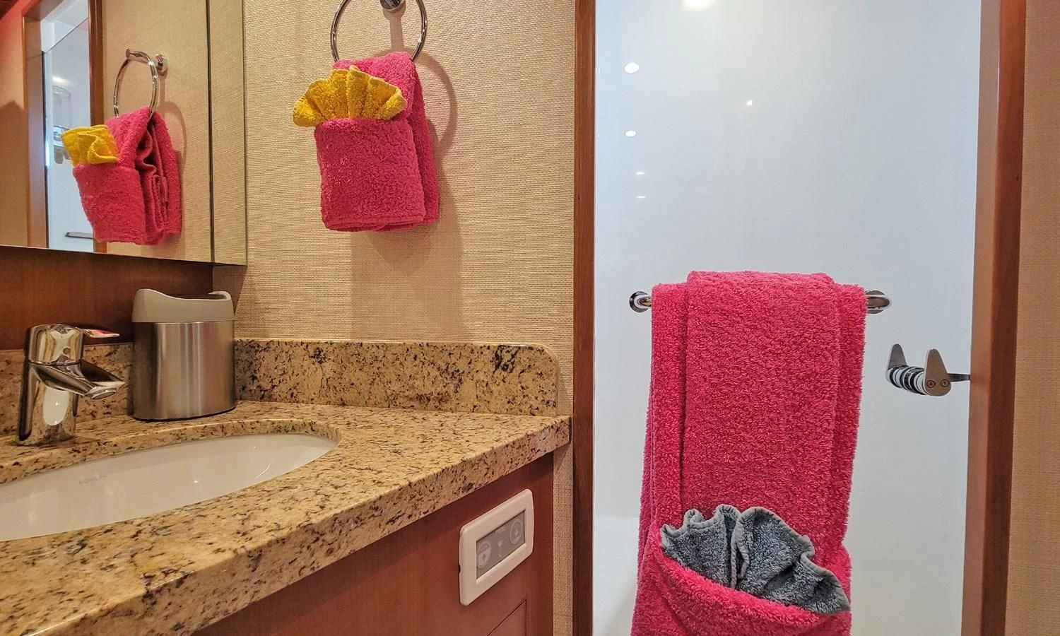 a bathroom with pink towels aboard SUERTUDO Yacht for Sale