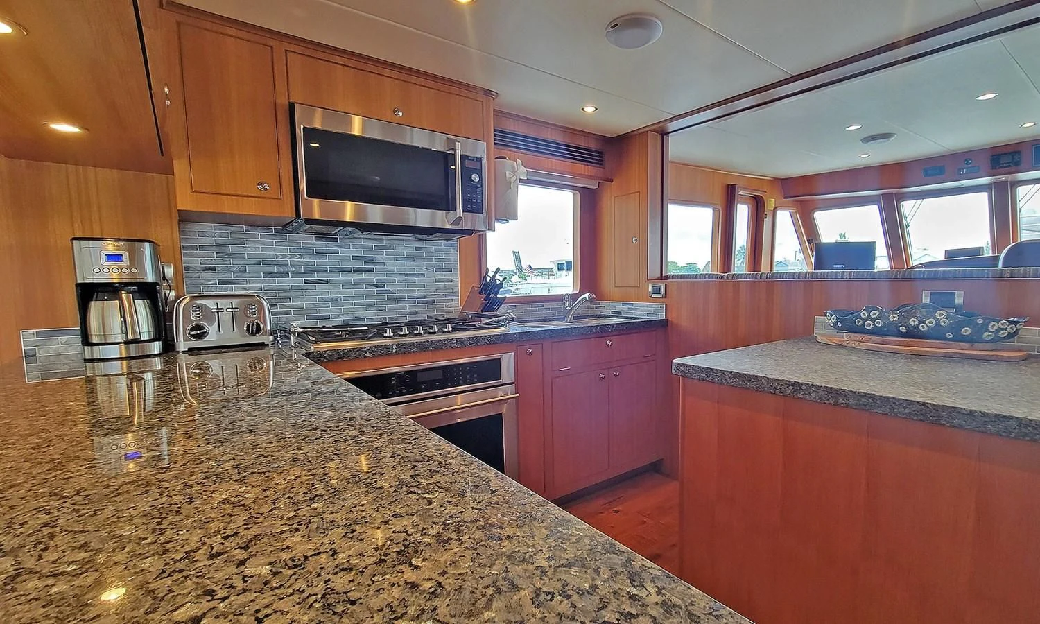 a kitchen with a granite counter top aboard SUERTUDO Yacht for Sale