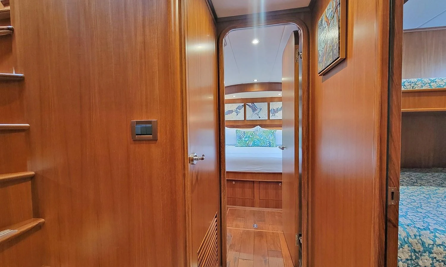 a room with a door and a mirror aboard SUERTUDO Yacht for Sale