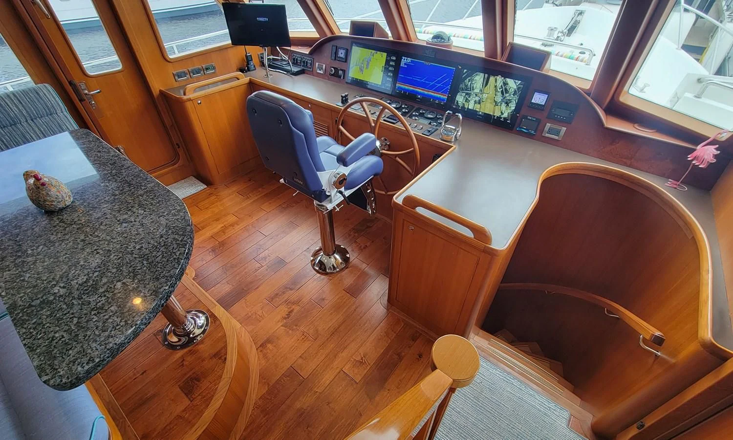 a chair and a desk in a classroom aboard SUERTUDO Yacht for Sale