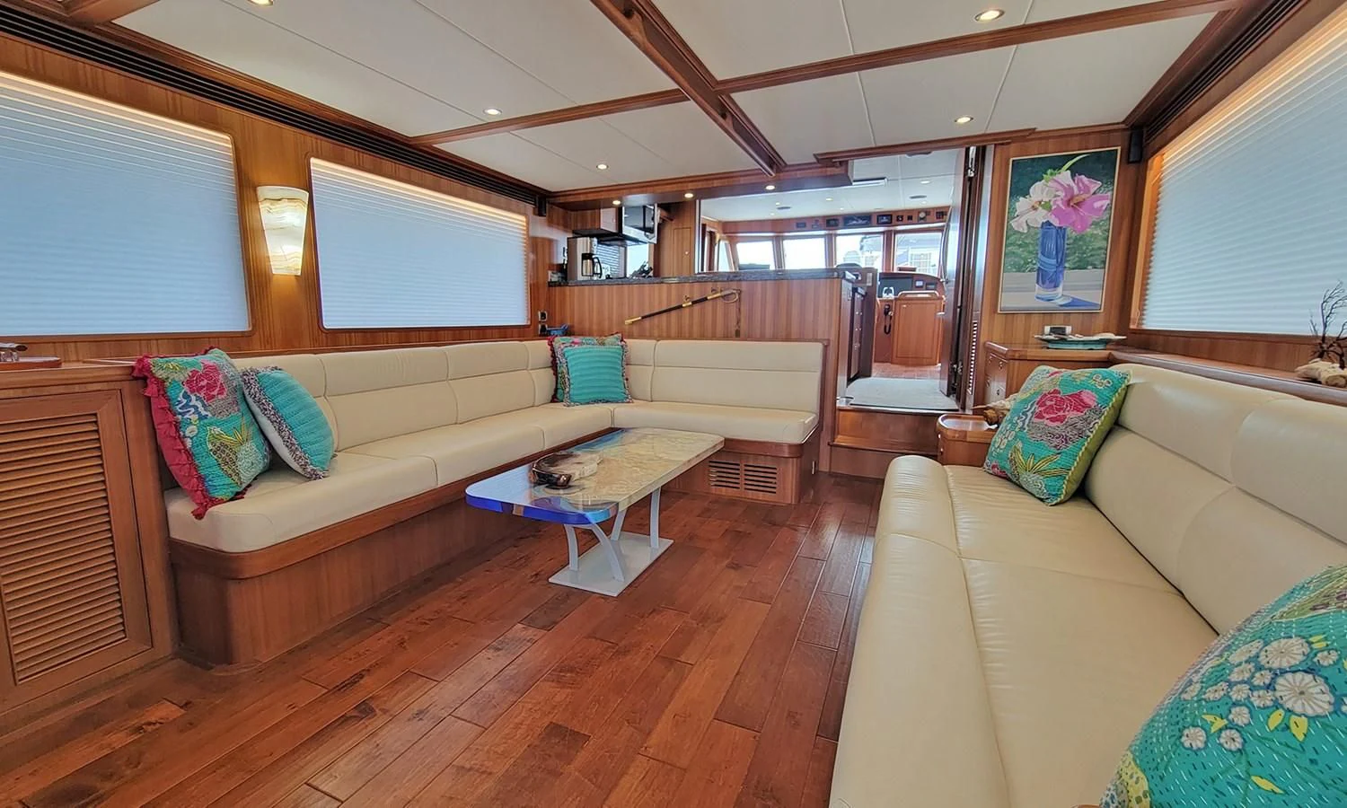a living room with a couch and a table aboard SUERTUDO Yacht for Sale