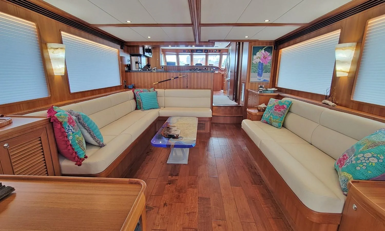 a living room with a couch and a table aboard SUERTUDO Yacht for Sale