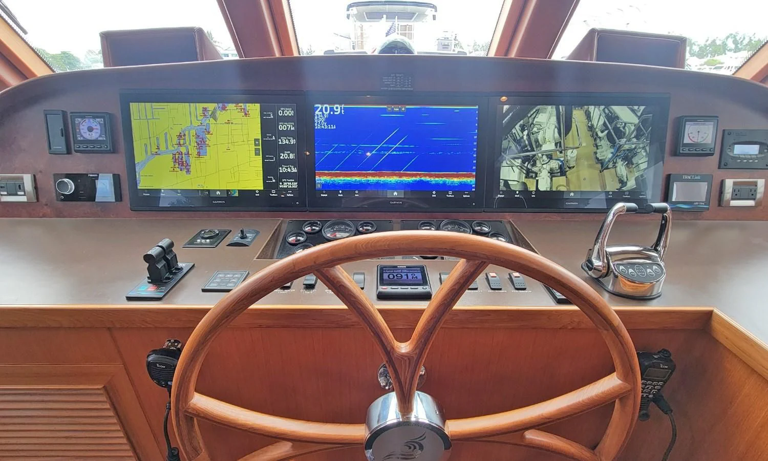 a table with a game console and game controllers on it aboard SUERTUDO Yacht for Sale