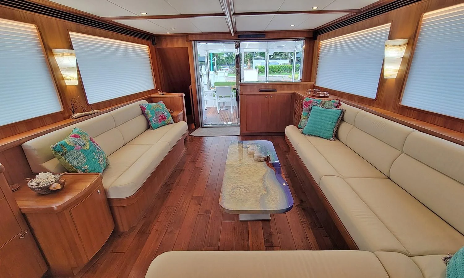 a living room with a couch and a table aboard SUERTUDO Yacht for Sale