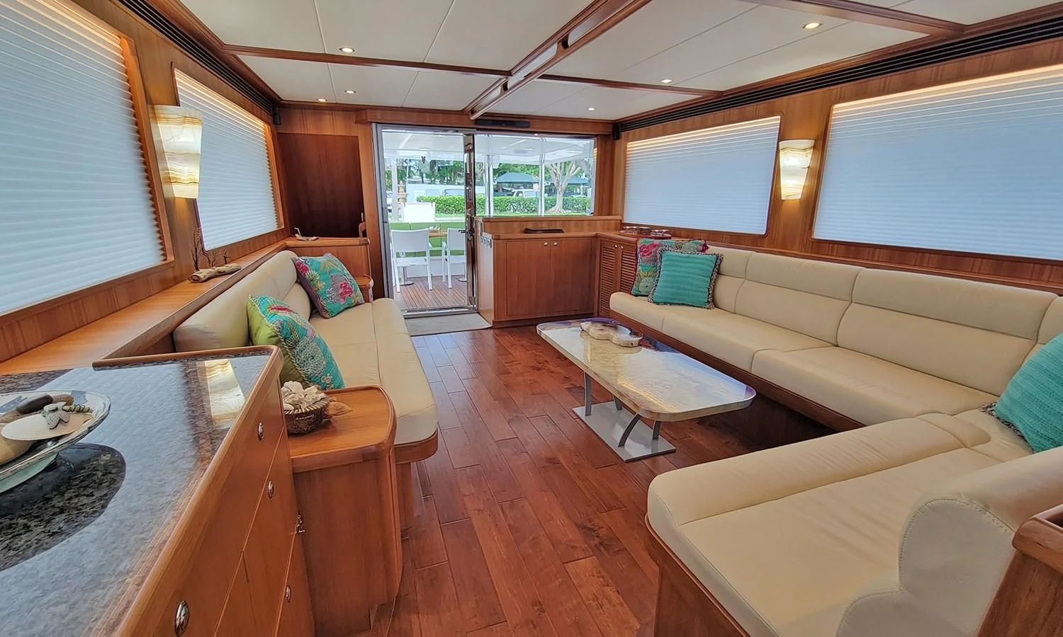 a living room with a couch and a table aboard SUERTUDO Yacht for Sale
